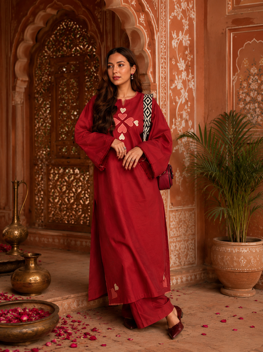 red embroidered kurta pant set for women with wide sleeves and straight pants